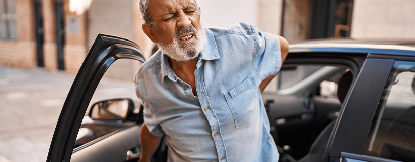 patient with back pain in need of auto accident injury care in Erlanger