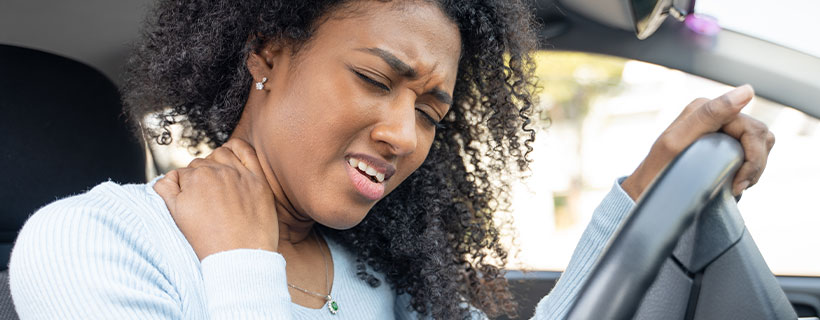 patient with neck pain in need of auto accident injury care in Erlanger